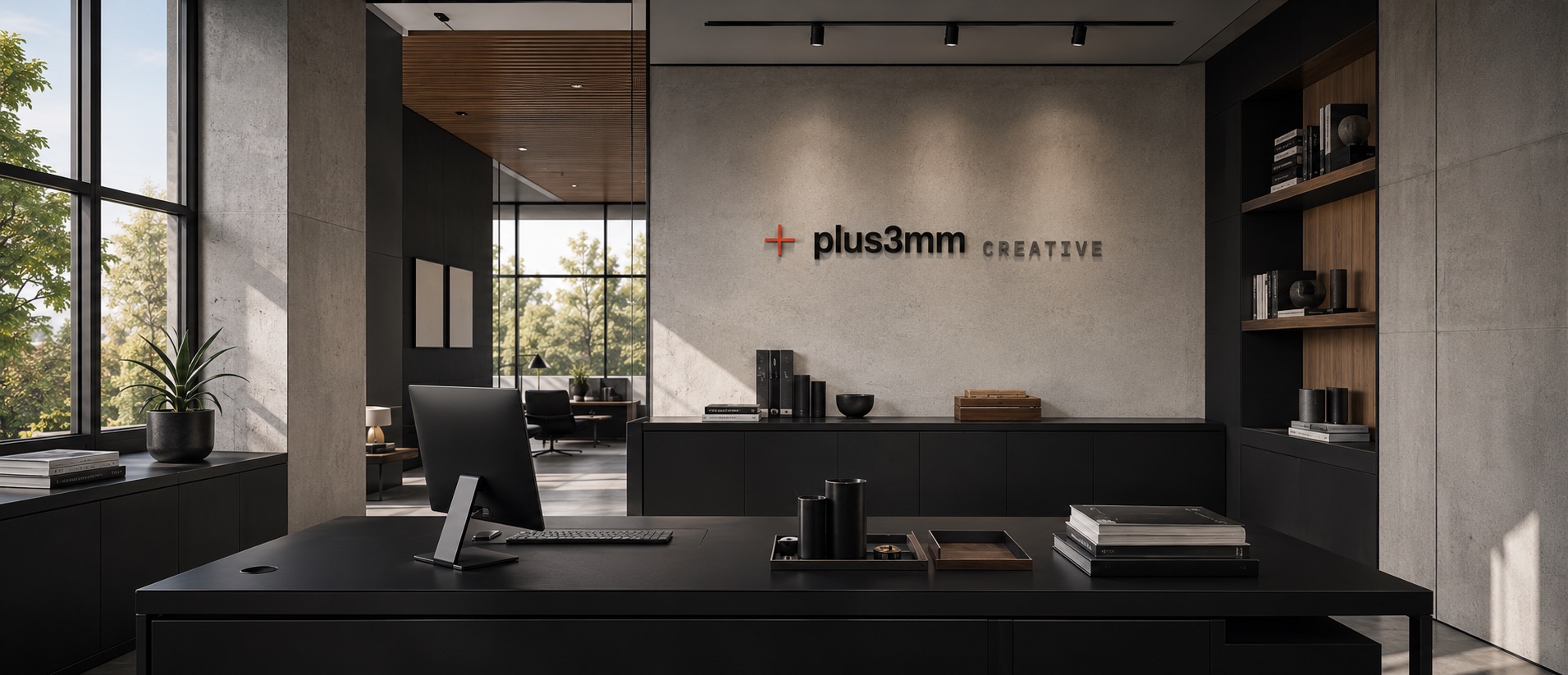 plus3mm Creative studio office interior with the plus3mm Creative wordmark on the wall
