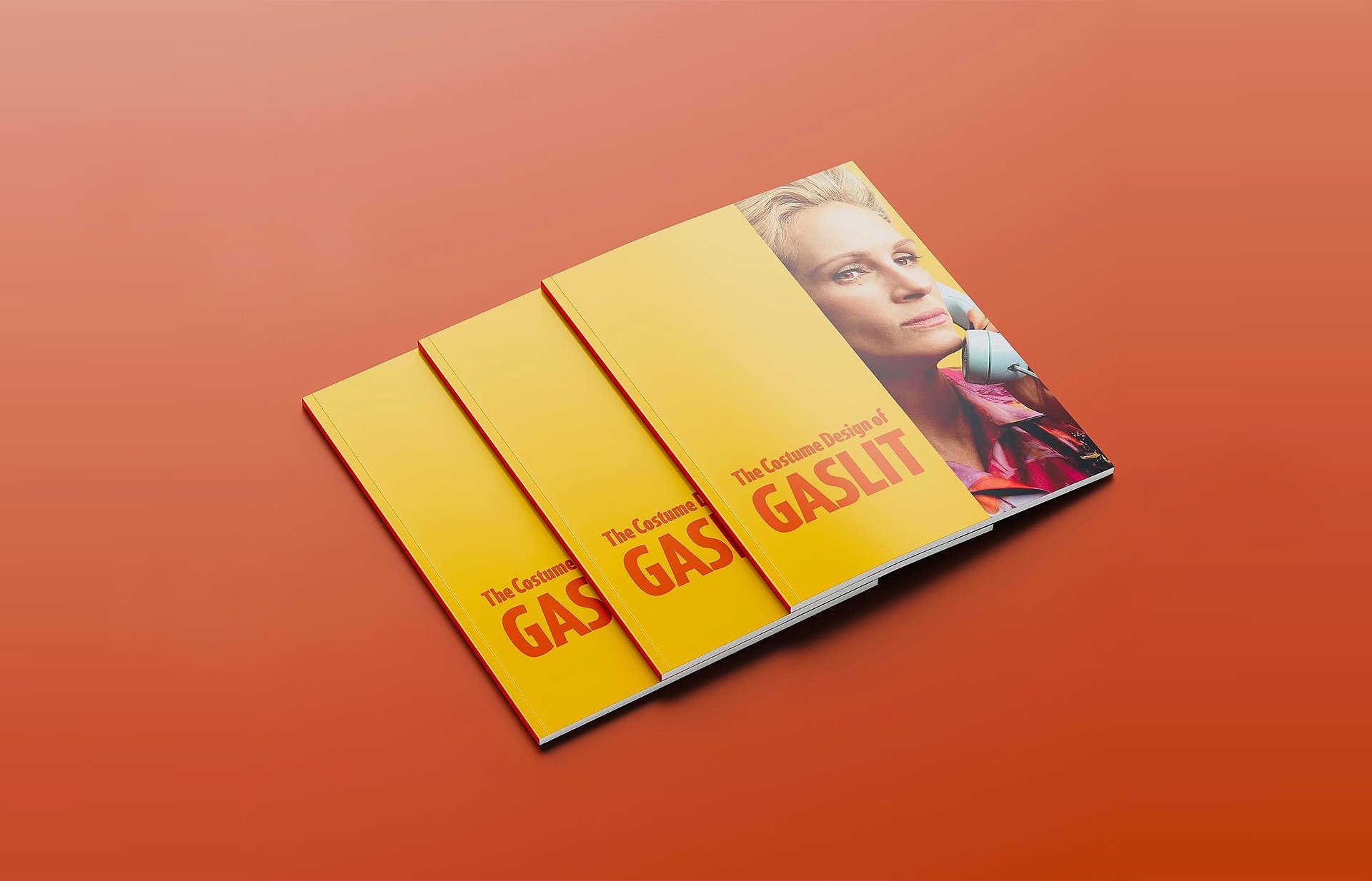 Gaslit For Your Consideration book cover mockup, three copies stacked on an orange background