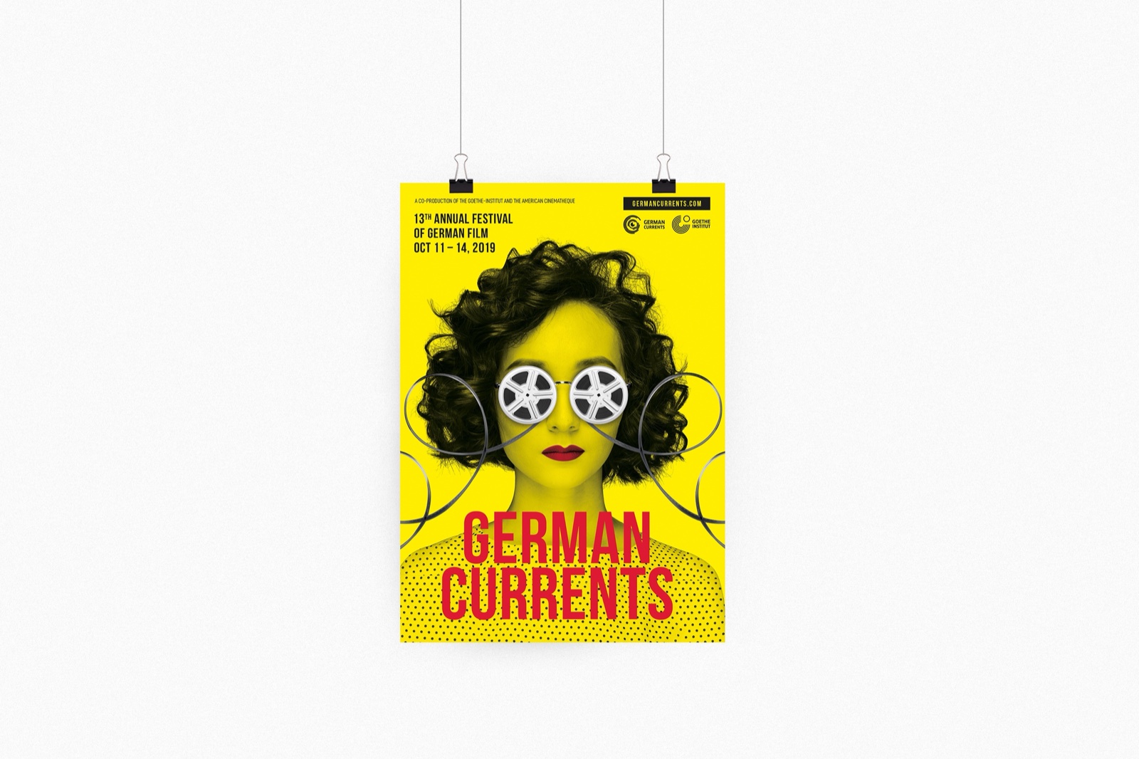 German Currents opening night poster mockup pinned to a wall