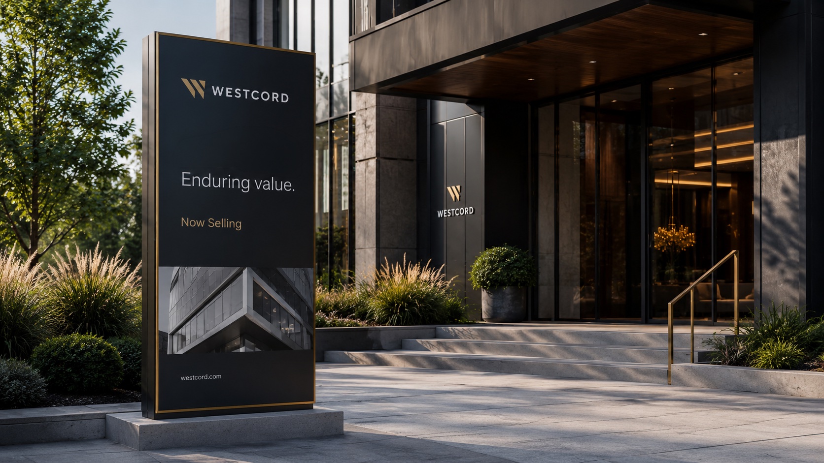 Westcord 'Now Selling' pylon sign and illuminated building entrance signage at dusk.