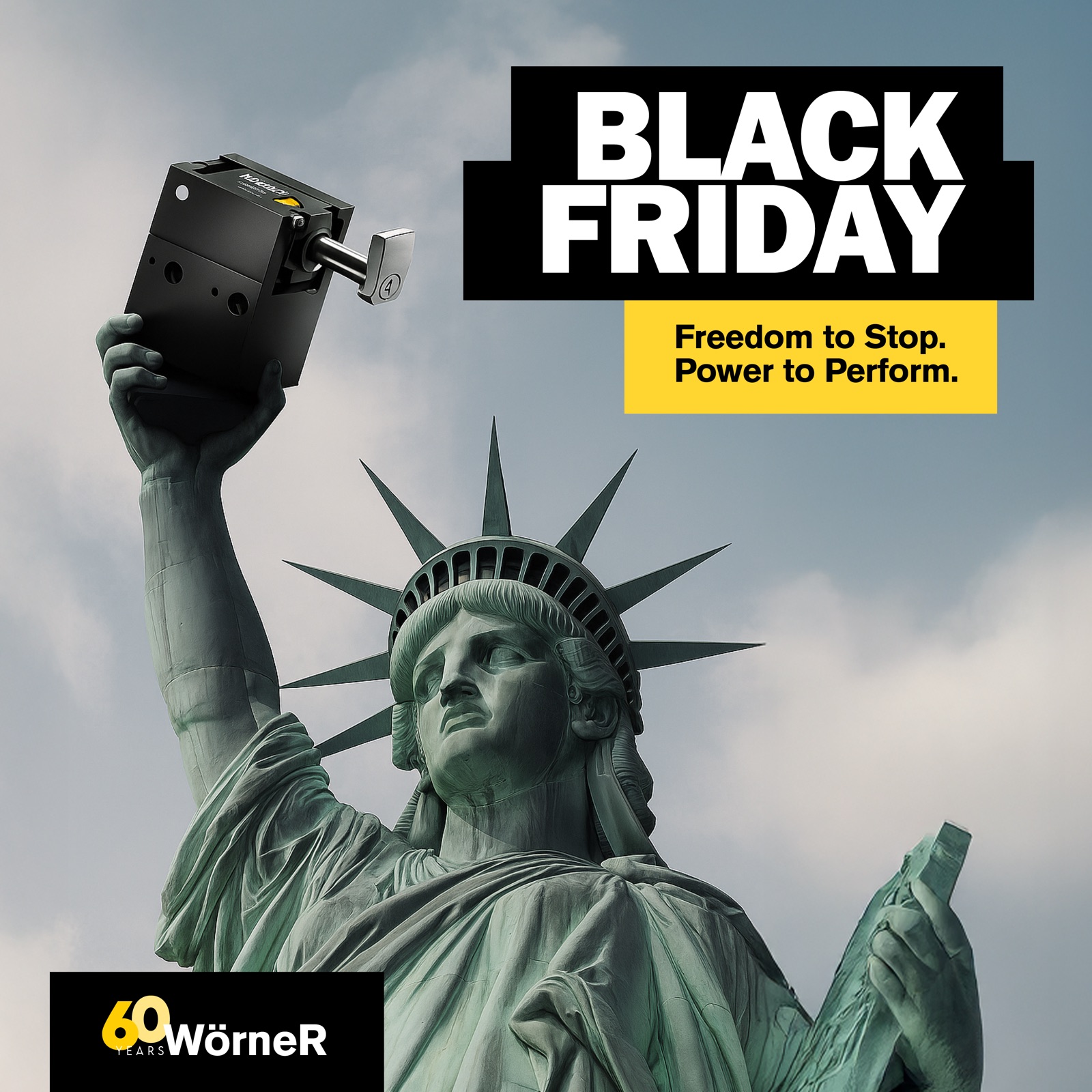 Woerner Black Friday billboard ad: the Statue of Liberty holds up a black stopper unit in place of her torch, with the headline 'Black Friday — Freedom to Stop. Power to Perform.'